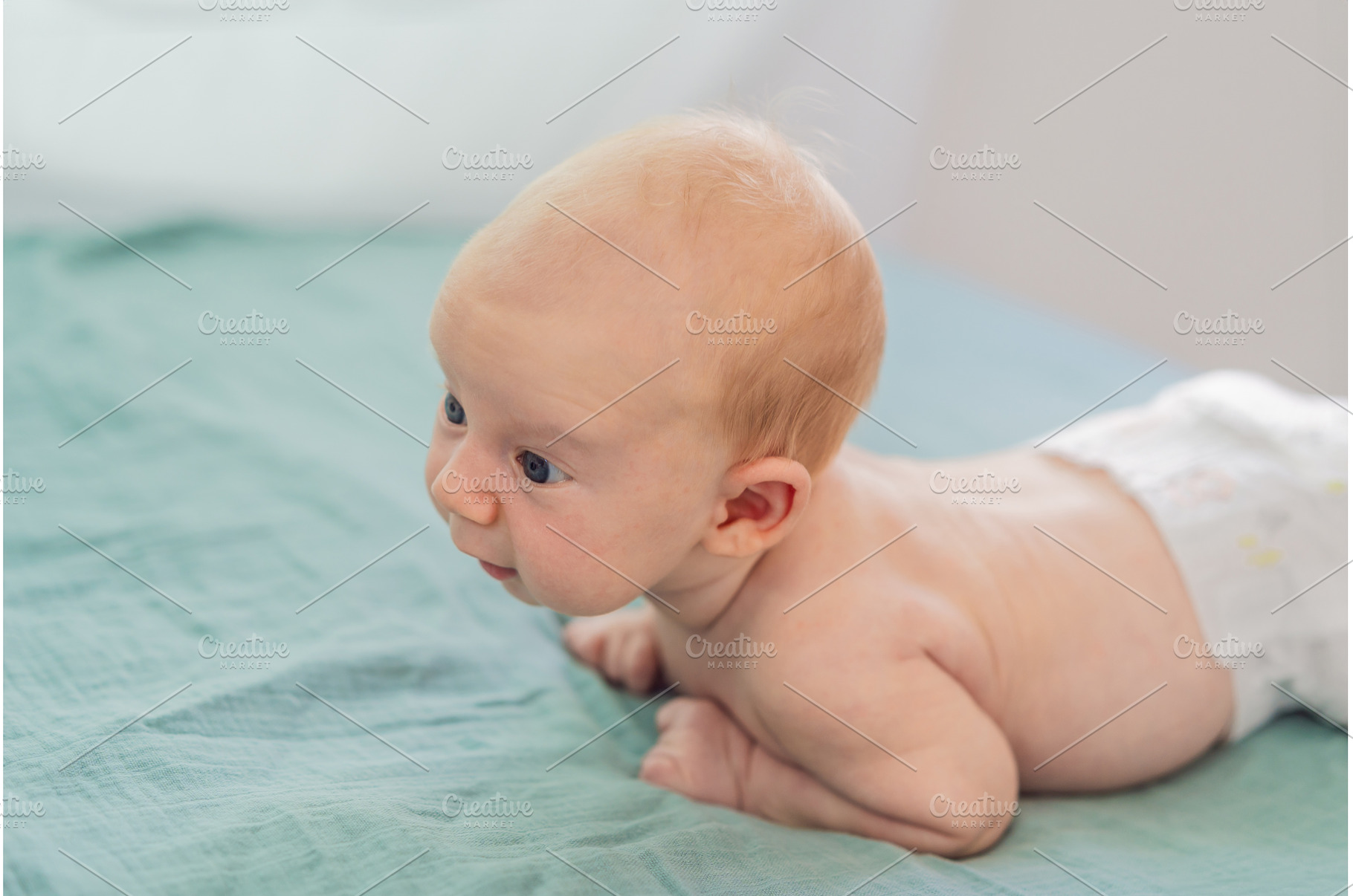 One-month-old baby lying on tummy, a Person Photo by Elizaveta Galitskaya
