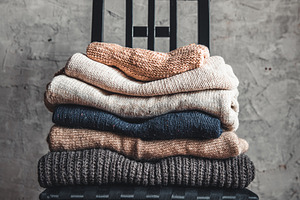 A stack of knitted warm cozy sweater stock photo containing christmas and