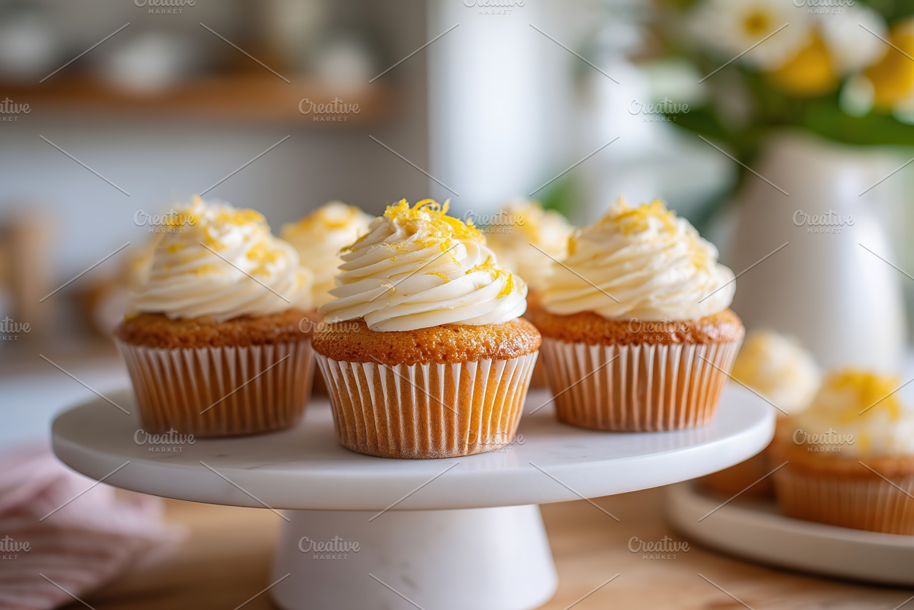 Delightful lemon cupcakes topped with creamy coconut frosting on a stylish disp, a Food & Drink Photo by AlyaAnd