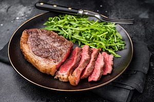 Appetizing grilled striploin steak with salad, inviting you to i, a Food & Drink Photo by composter-box@mail.ru