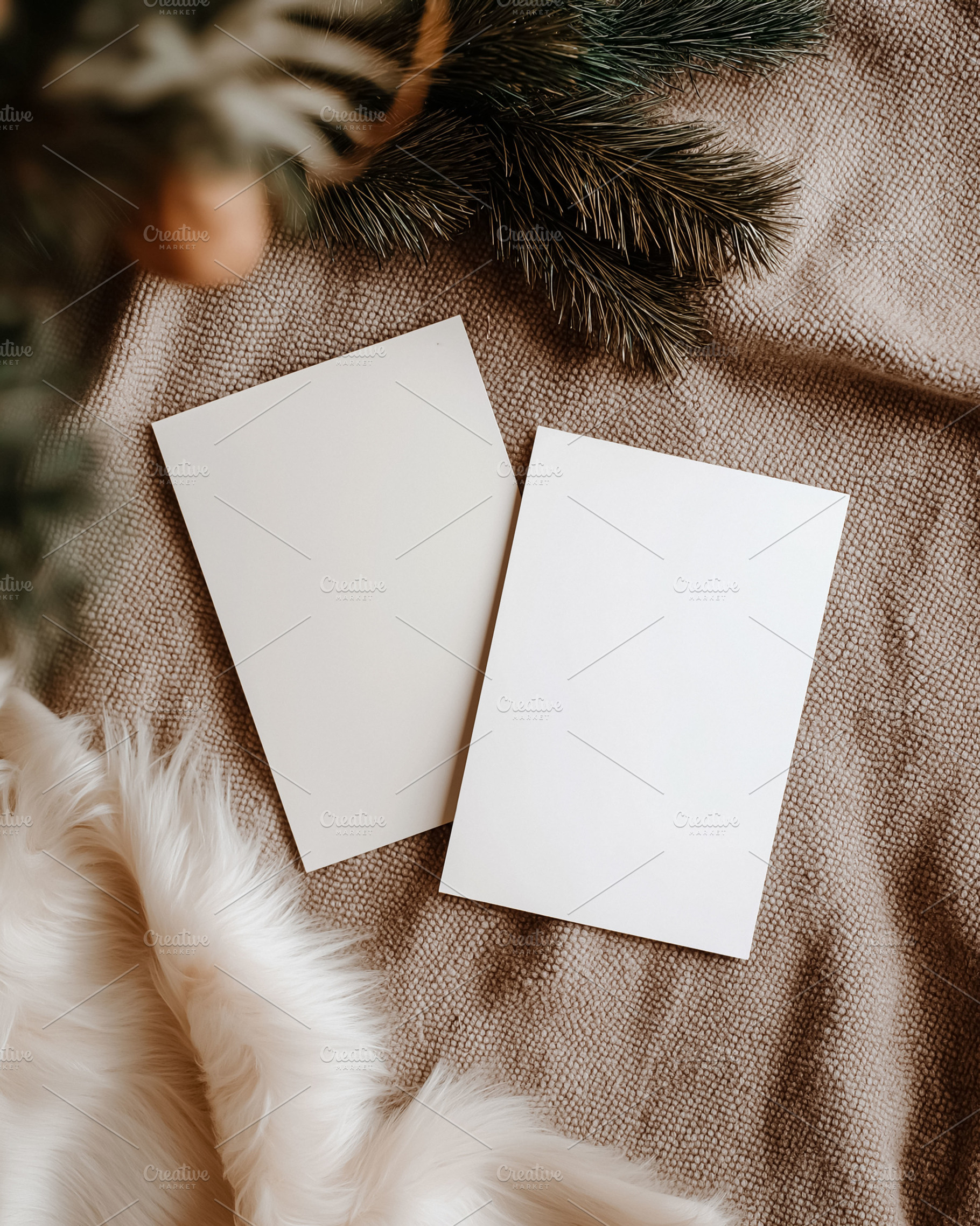 Blank Christmas invitation cards with pine branch and fur creating a cozy holid, a Holiday Photo by Studio ANNA