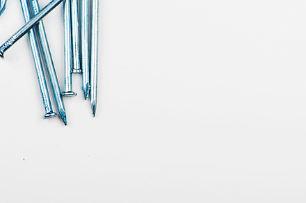 Nails on white background copy space isolated featuring nail, nails, and metal, an Industrial Photo by José Luis Agudo