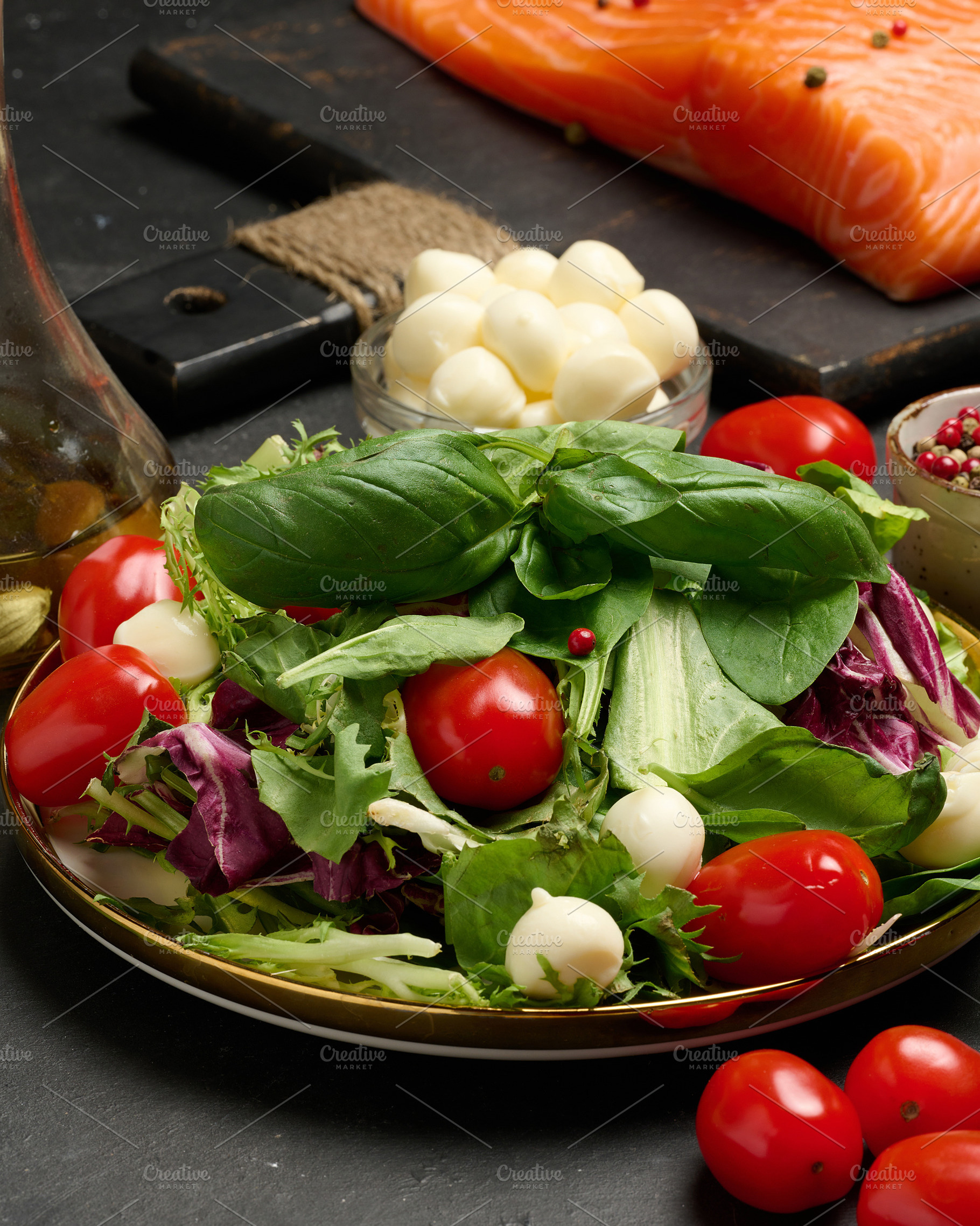 Close-up of a plate with fresh lettuce, cherry tomatoes, mozzare, a Food & Drink Photo by ndanko