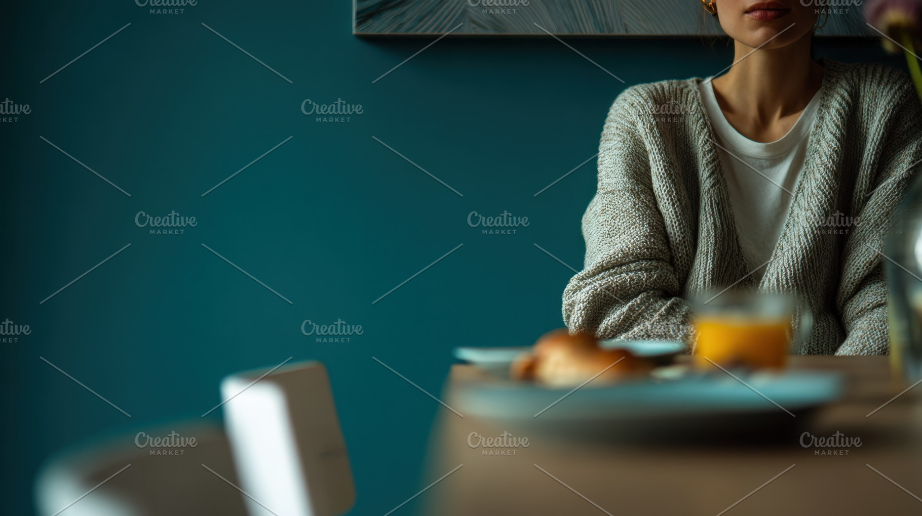 Woman sits at table with breakfast, a Photo by Beautiful things