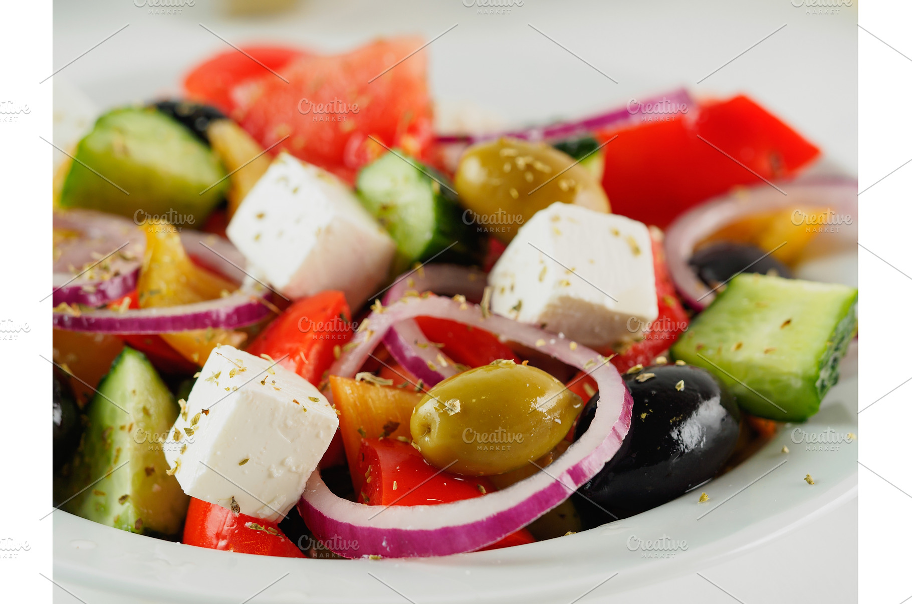 Greek salad on the table, close up, a Food & Drink Photo by Fascinadora