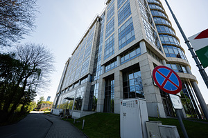 Modern office building and corporate facade in Katowice Poland with glass windo, a Photo by AS photostudio