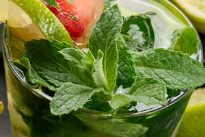 Refreshing mojito cocktail with lime, mint, strawberry, and ice, a Food & Drink Photo by ndanko