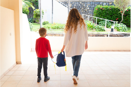 Mother and boy going to school, a Person Photo by Neirfy