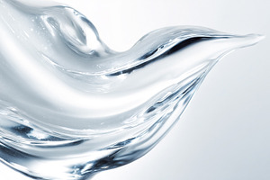 Clear liquid splashing in a clean wave creating an abstract dyna, a Photo by Studio ANNA
