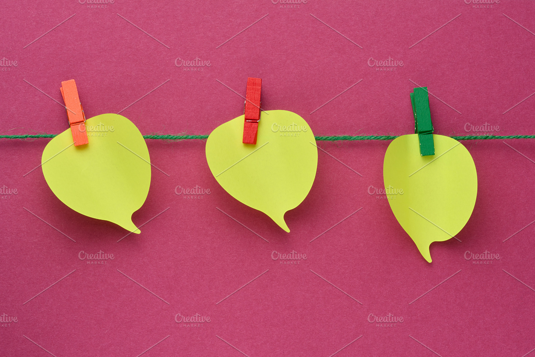 Three yellow thought cloud-shaped sticky notes attached to a rop, a Business Photo by ndanko
