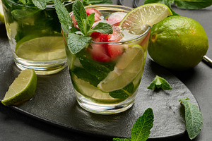 Refreshing mojito cocktail with lime, mint, strawberry, and ice, a Nature Photo by ndanko
