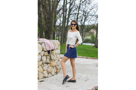 Young woman in short denim skirt and, a Person Photo by serkum