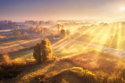 Aerial view of village in fog with, a Nature Photo by den-belitsky