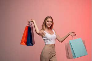 Young woman enjoying shopping trip, a Beauty & Fashion Photo by volodymyrshtun13795