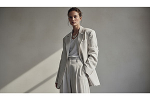 A poised figure in soft warm white, a Beauty & Fashion Photo by Igor Tichonow