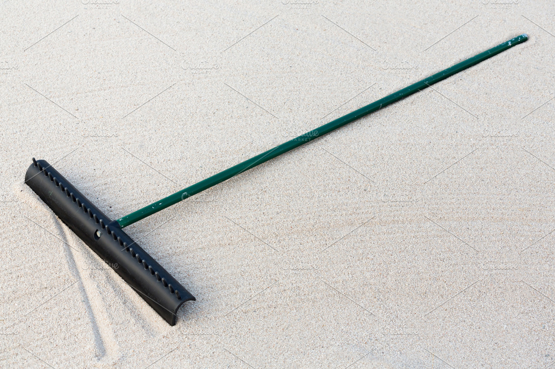 Golf Sand Rake, a Background Photo by Smith Chetanachan