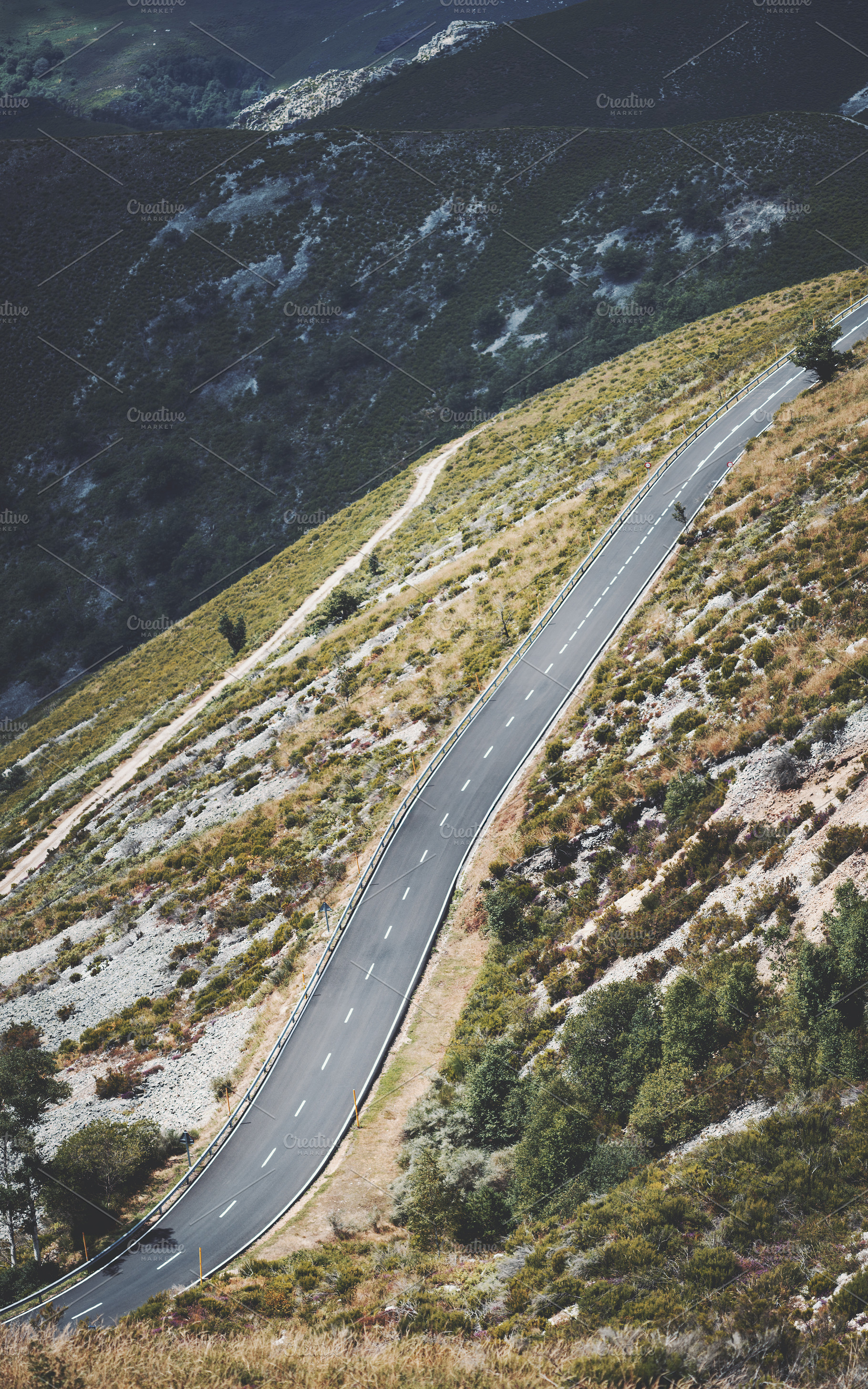 Winding mountain road, a Transportation Photo by SkyNext
