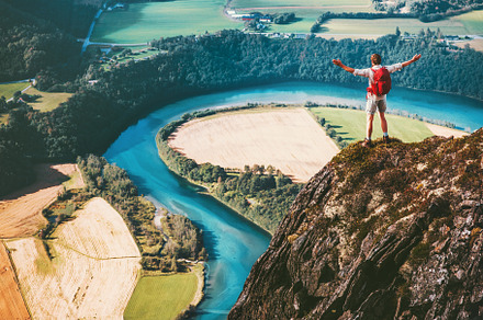 Success Man backpacker on cliff, a Sports & Recreation Photo by e v e r s t