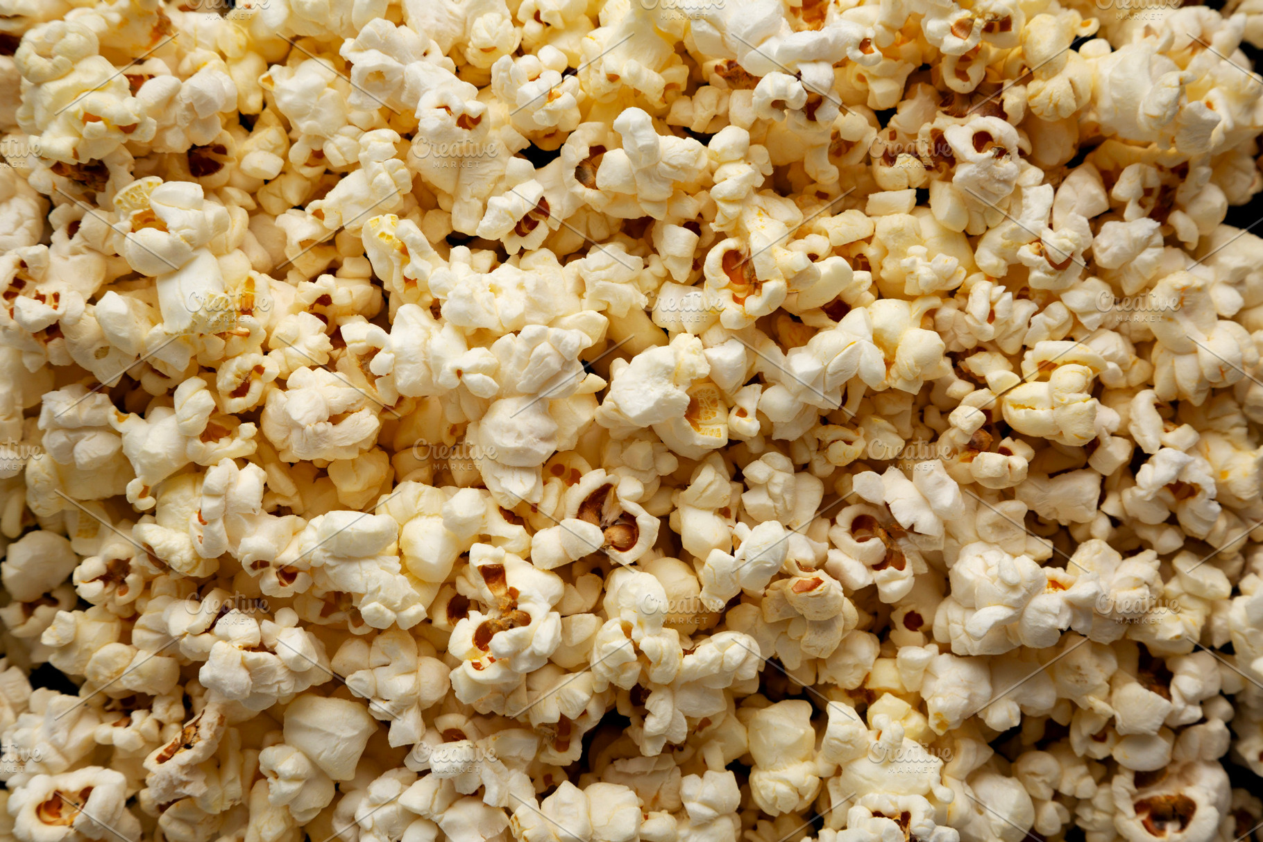 Homemade Butter Popcorn with Salt, top view. Overhead, from abov, a Food & Drink Photo by LiudmylaChuhunova