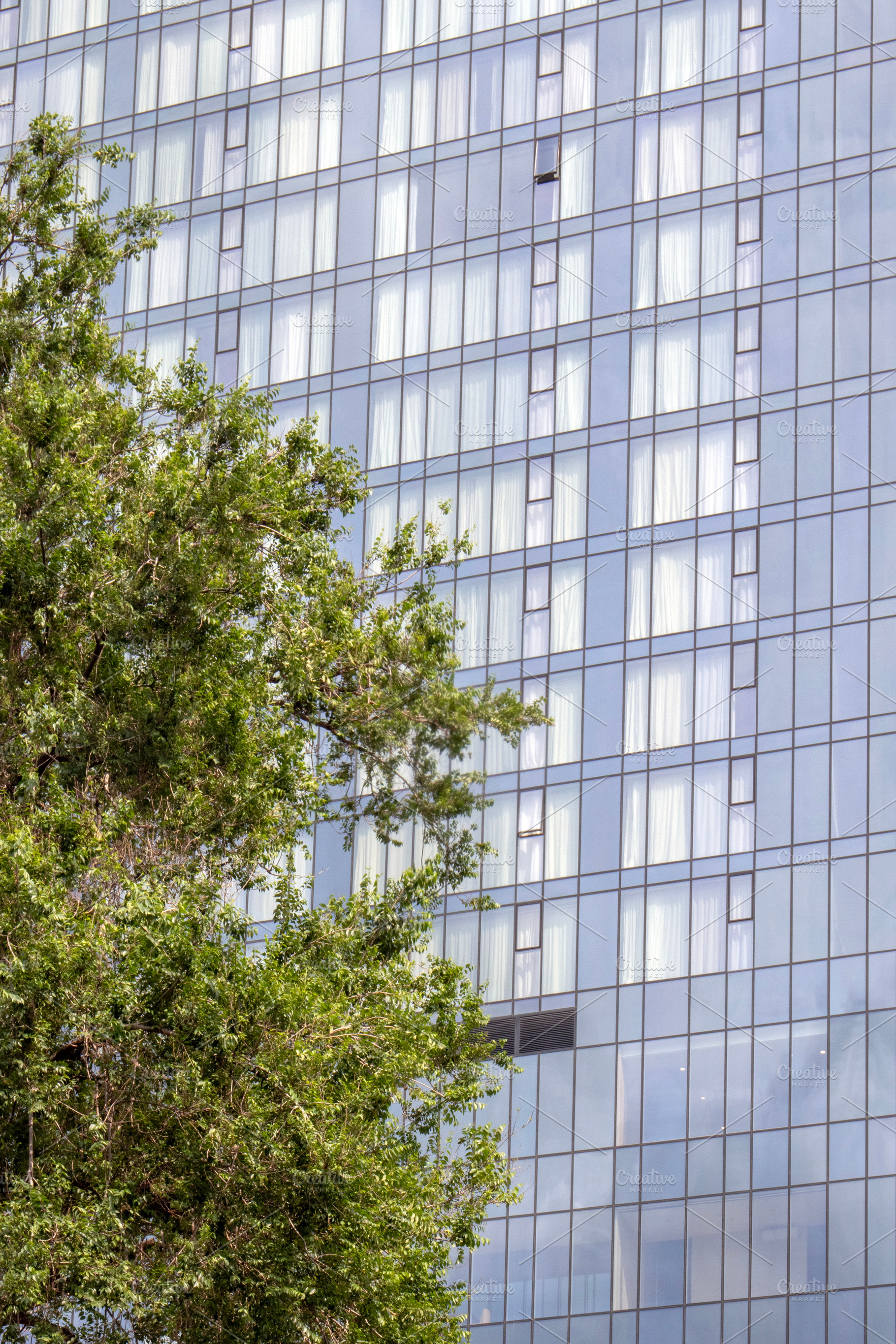 A view of the modern glass façade, an Architecture Photo by Schreibikus