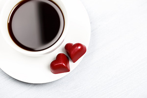Coffee cup and red heart candies on, a Food & Drink Photo by Anna Efetova