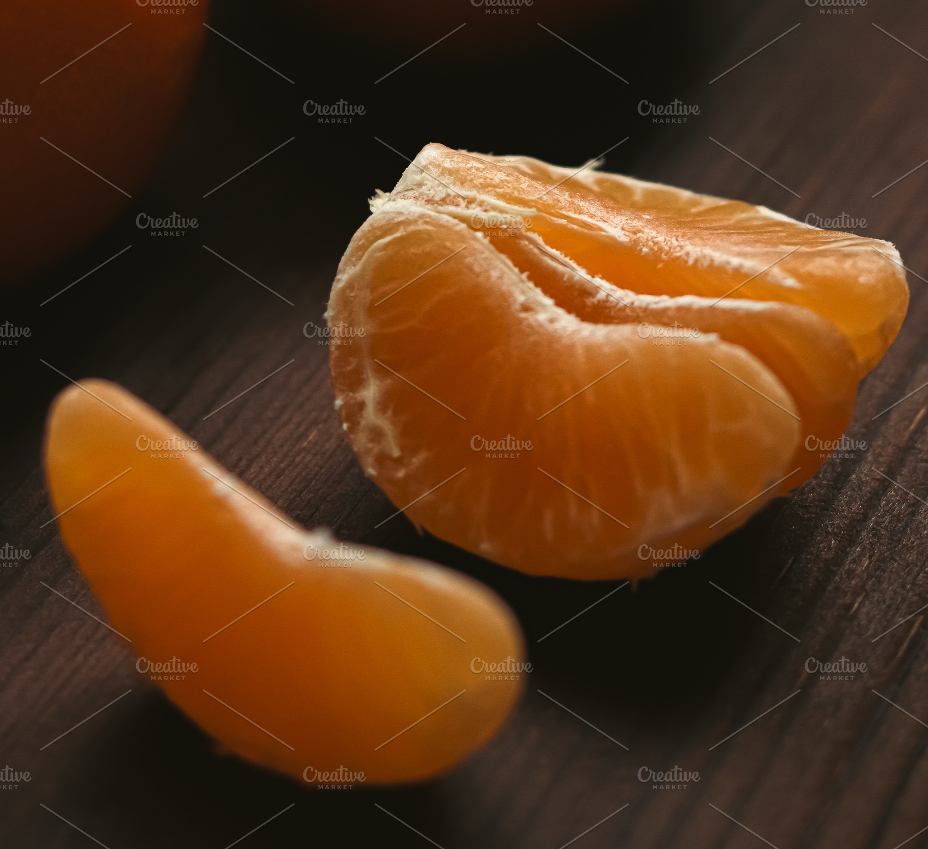Tangerine segments peeled, showing the juicy fruit, a natural source of vitamin, a Photo by Studio ANNA