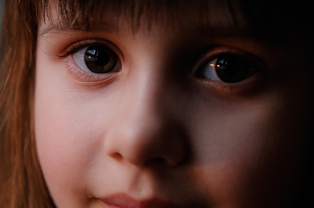 Close-up Portrait of a Sweet Little Girl with Brown Eyes.