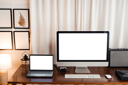Computer  and Laptop  on the desk mock up at home office, a Technology Photo by Art Rachen
