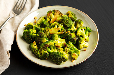 Homemade Pan-Fried Broccoli on a Plate on a black background, si, a Food & Drink Photo by LiudmylaChuhunova