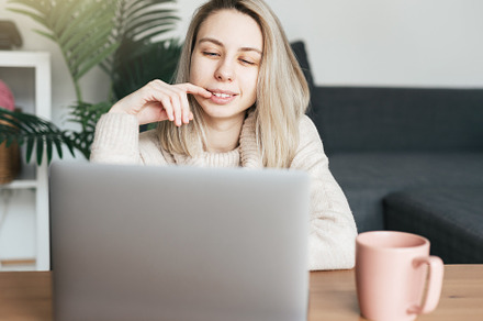 Young woman working on laptop in  home, a Person Photo by Olena Rudo