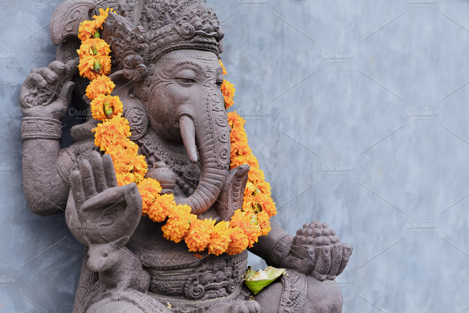 Ganesha sitting in meditating pose featuring bali, ganesha, and yoga, an Abstract Photo by Tropical Studio