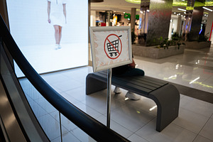 Prohibited shopping carts sign inside a modern shopping mall interior, a Photo by AS photostudio