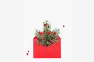 Christmas tree symbol in red envelop featuring christmas tree, envelope, and