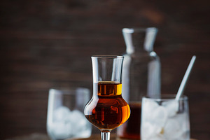 A shot of a strong ligueur with ice stock photo containing selective focus