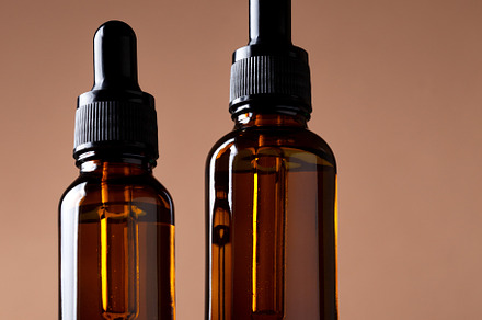 glass brown bottles with a cosmetic