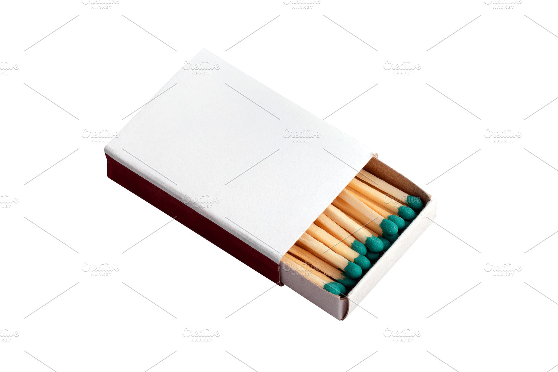 Open matchbox with green-tipped wooden matches over white backgr, an Industrial Photo by Ales Munt