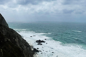 Cliffside coastline above the Atlantic Portugal, during a cloudy stormy day, a Photo by AS photostudio