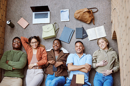 College floor, diversity portrait and students collaboration on group research project, university study or education learning. Knowledge, teamwork or top view of happy friends relax on school campus, a Photo by Peopleimages.com