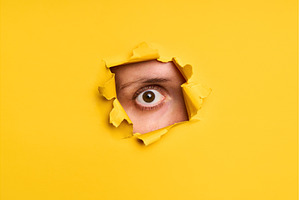 Human eye looking through torn, a Background Photo by Gladkov photography