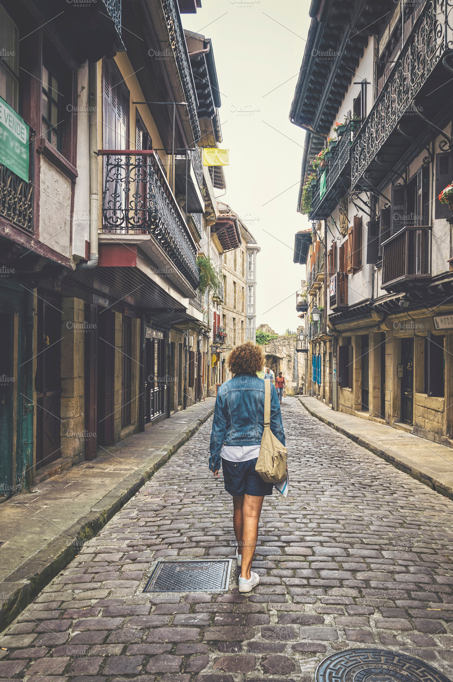 Woman walking down the street featuring woman, walking, and woman walking, a Person Photo by Architect´s eye