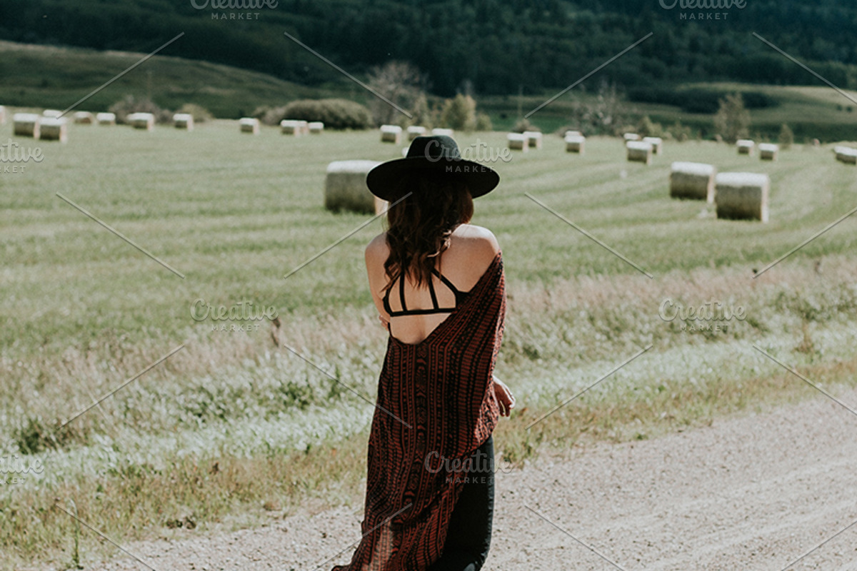 Woman walking down the road, a Person Photo by Wild Wander Collective (Photo 2 of 2)