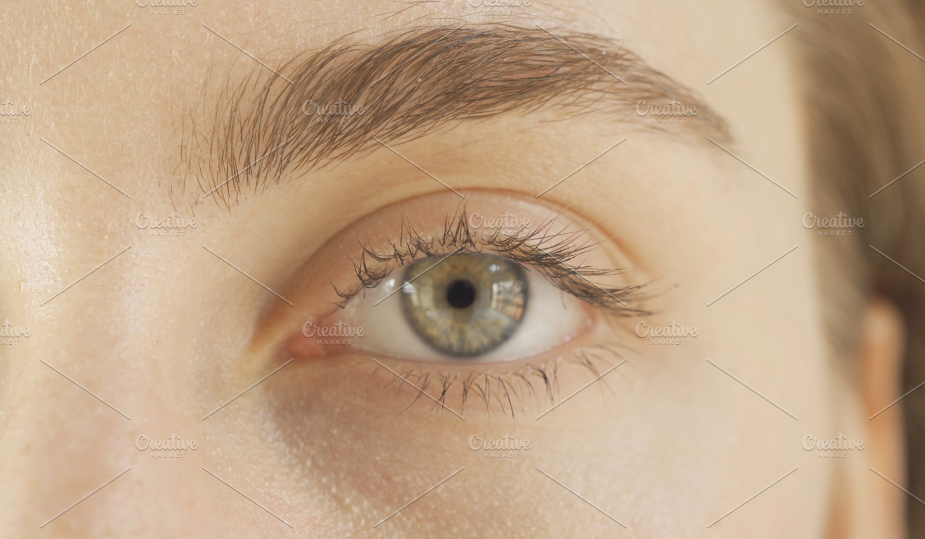Woman eyes and face. Close-up of blonde caucasian girl. Texture, a Photo by Tampatra
