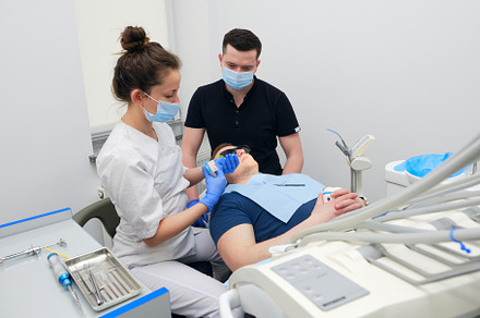 Preparing for Crown Placement: Dentist Checking the Fit. Dental Procedure Under