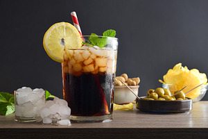 Refreshing cola drink on wooden table with snacks black backgrou, a Food & Drink Photo by Davizro's Market