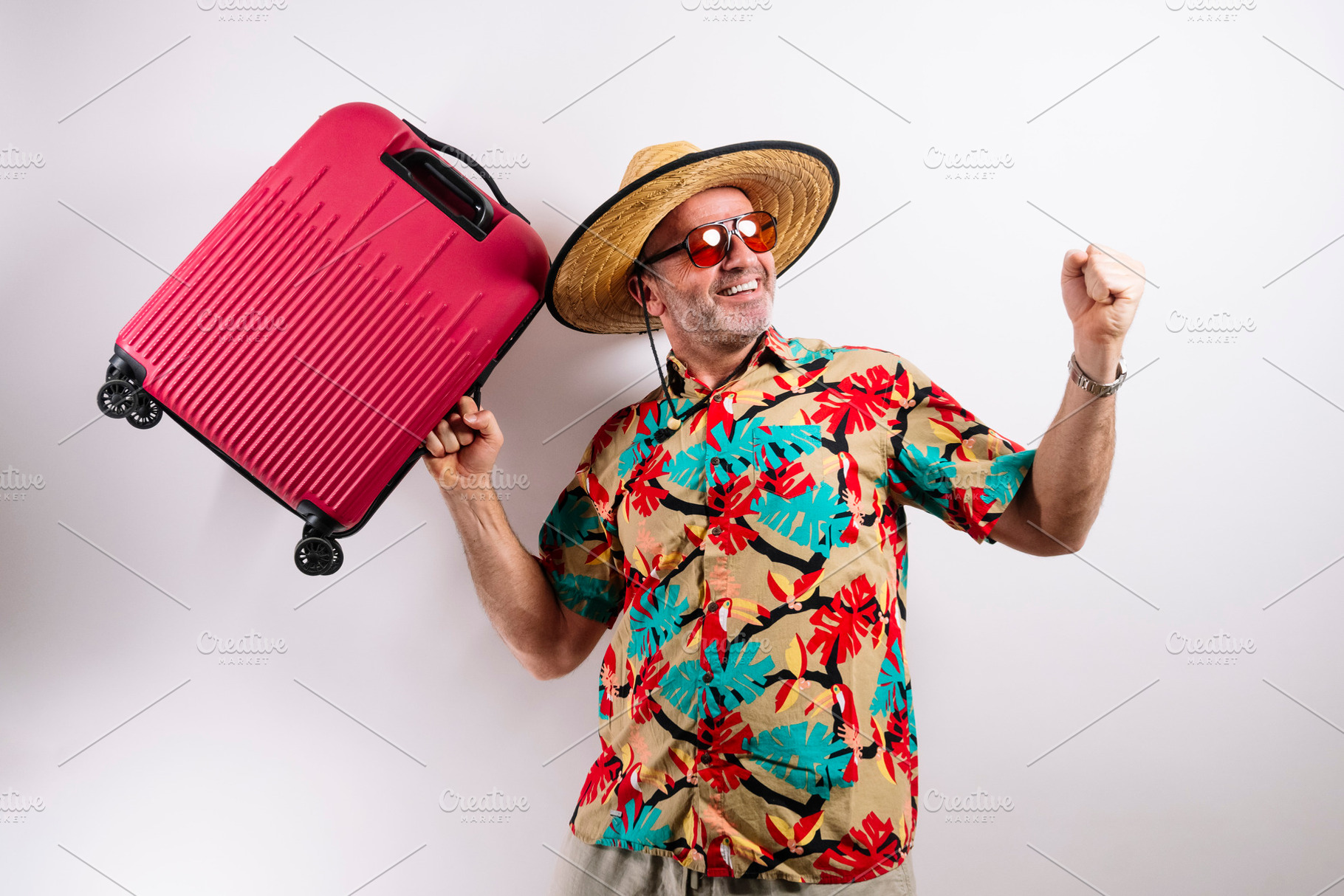 Happy man ready for vacation with suitcase., a Holiday Photo by karrastock