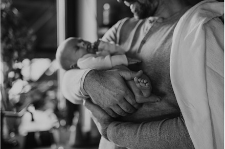 Close-up of father holding his, a Person Photo by HalfPoint