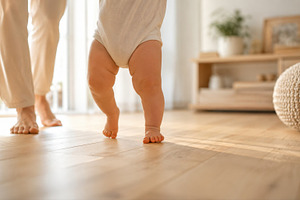 Baby learns to walk with parent, a Photo by Beautiful things