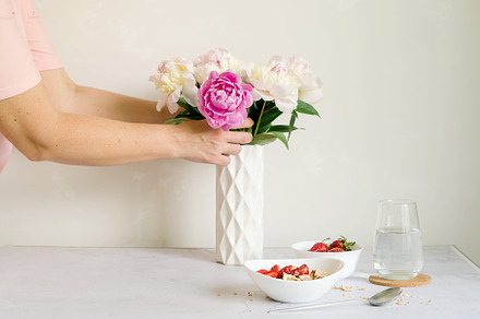 breakfast serving with granola and peony bouquet, a Background Photo by vimart