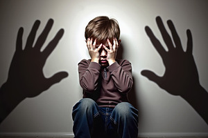 Scared child covering his face with, a School & Education Photo by Perpis