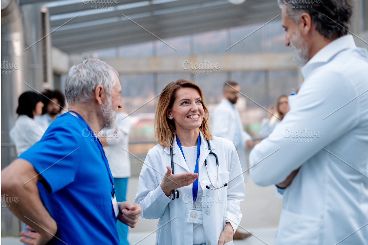 Group of doctors talking during, a Graphic by HalfPoint